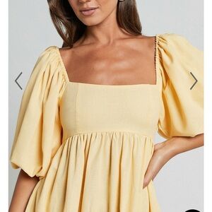 Shop pow yellow formal dress with puff sleeves! Never worn, fits true to size.